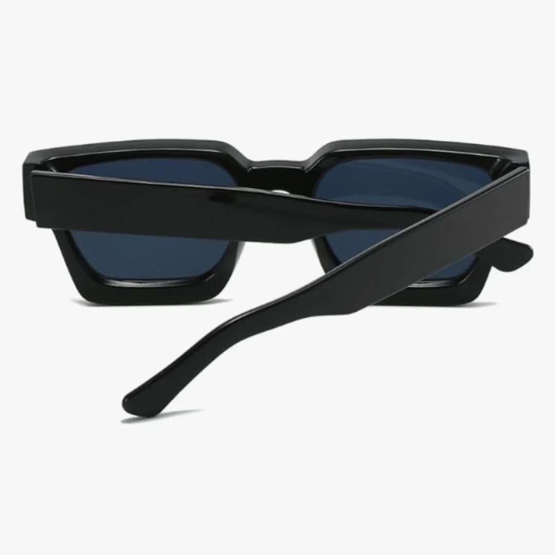 Rear view with crossed temples of Valencia women’s square sunglasses in Black frame with Black lenses, on white background — acetate frame, polycarbonate lenses, 100% UV protection