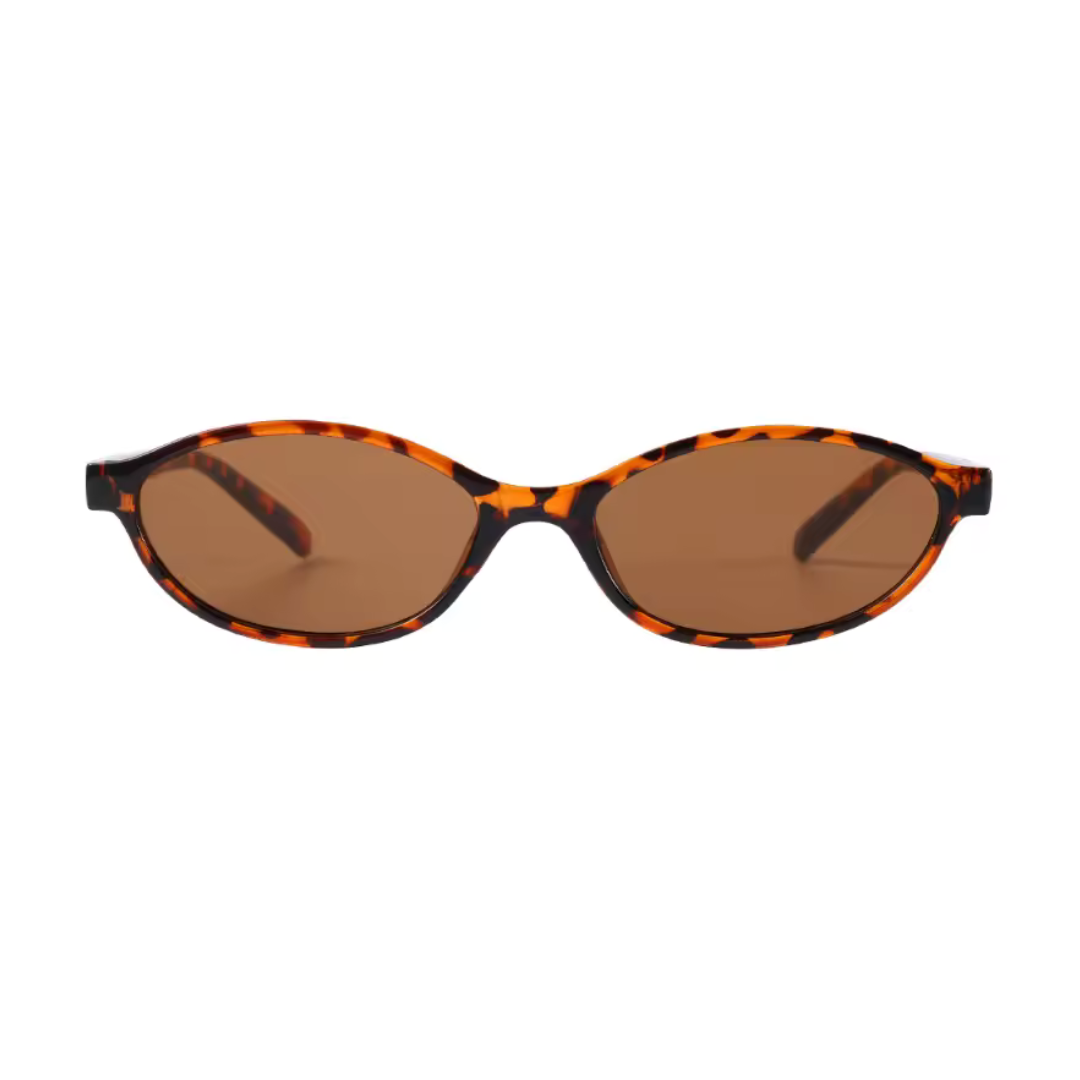 Boldé oval slim women's sunglasses in Leopard polycarbonate frame with amber polycarbonate lenses, 100% UV protection, front view on white background