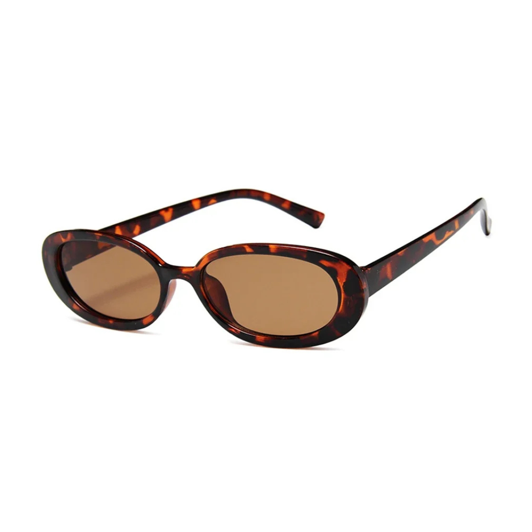 Amélie oval women's shades in Tortoise polycarbonate frame with amber acrylic lenses, 100% UV protection, right 3/4 angle on white background