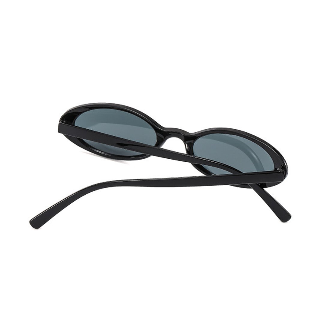 Évara oval women's shades in Black polycarbonate frame with black polycarbonate lenses, 100% UV protection, rear view with crossed temples on white background