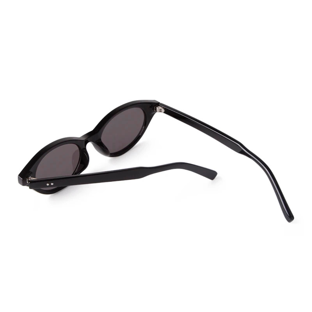 Rear view of Sovereign women’s oval slim  shades in Black frame with Black lenses, temples open, on white background — polycarbonate frame, acrylic lenses, 100% UV protection