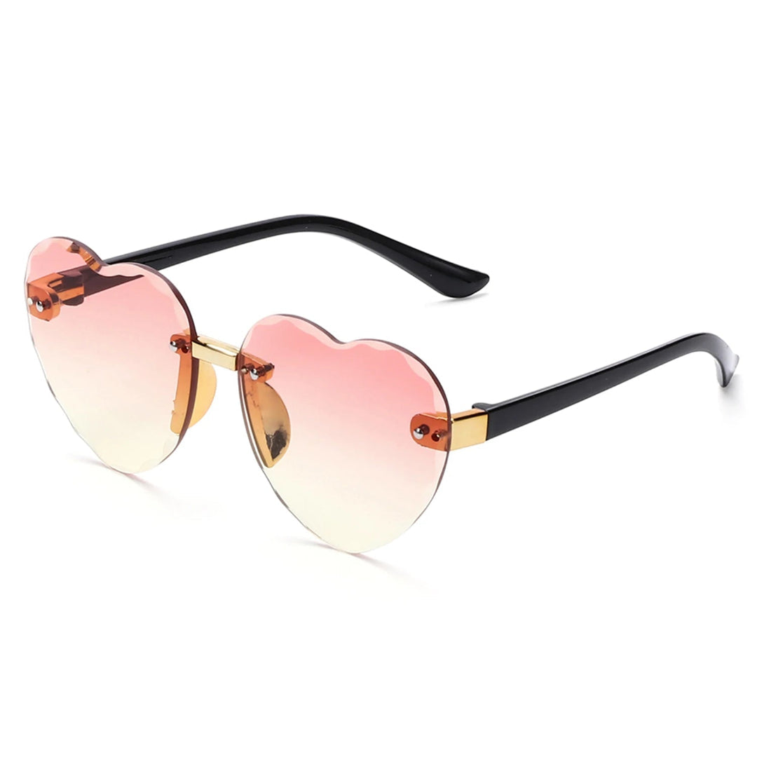 Noémie women’s heart-shaped sunglasses in Black frame with Rose Gradient lenses, right 3/4 angle on white background — polycarbonate frame, polycarbonate lenses, 100% UV protection