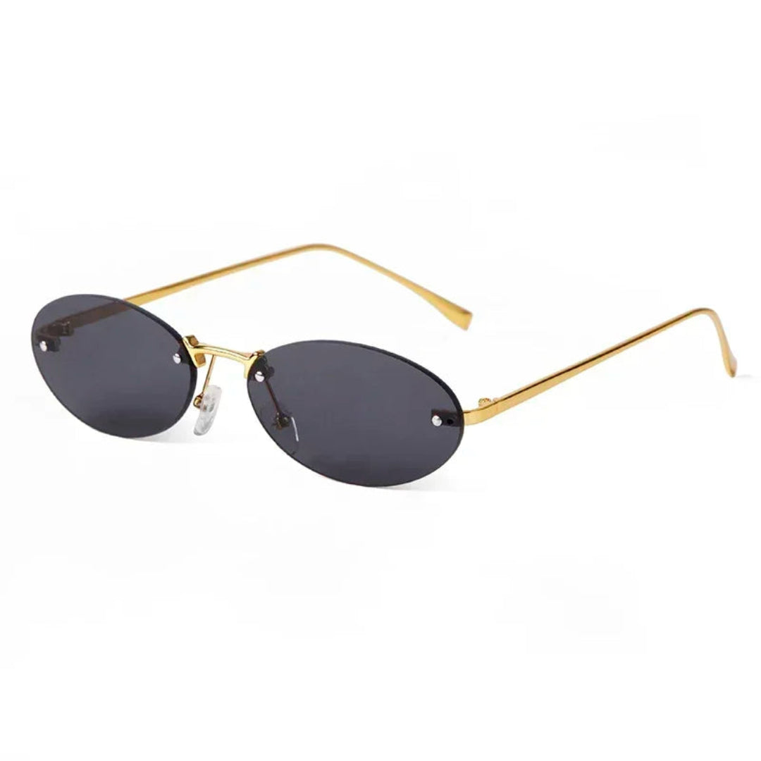 Velvet women’s oval sunglasses in Gold frame with Black lenses, right 3/4 angle on white background — metal frame, acrylic lenses, 100% UV protection