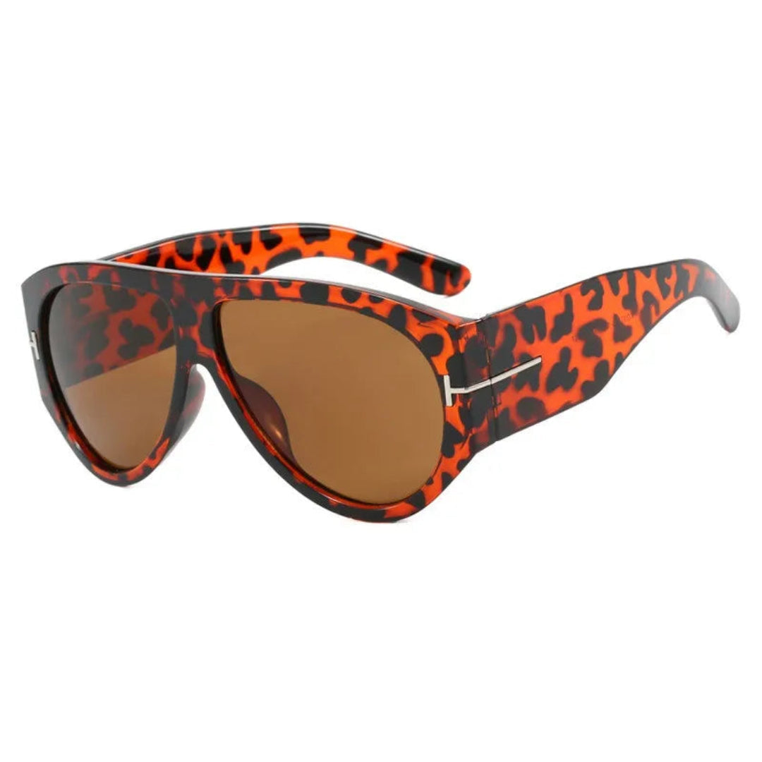 Cannes oversized shield women's sunglasses in leopard acetate frame with amber TAC lenses, 100% UV protection, right 3/4 angle view on white background