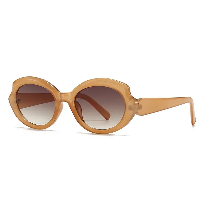 Amoura oversized round women's shades in amber acetate frame with brown gradient polycarbonate lenses, 100% UV protection, left 3/4 angle front view on white background