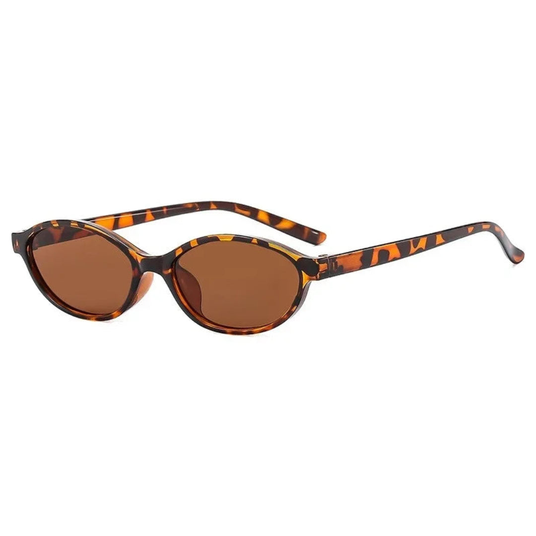 Boldé oval slim women's shades in Leopard polycarbonate frame with amber polycarbonate lenses, 100% UV protection, right 3/4 angle view on white background