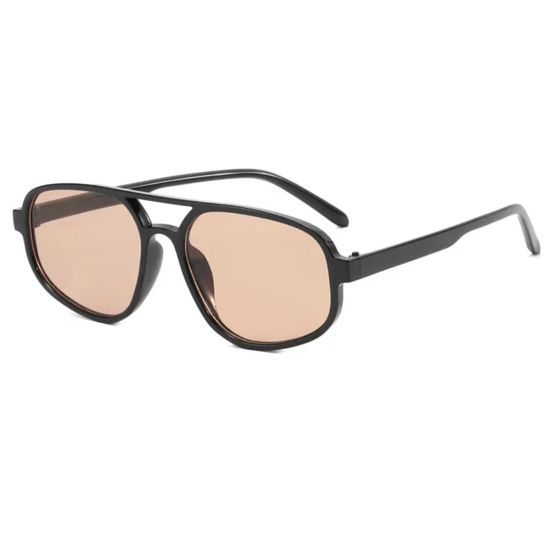 Brigitte aviator women's shades in black polycarbonate frame with amber acrylic lenses, 100% UV protection, right 3/4 angle view on white background