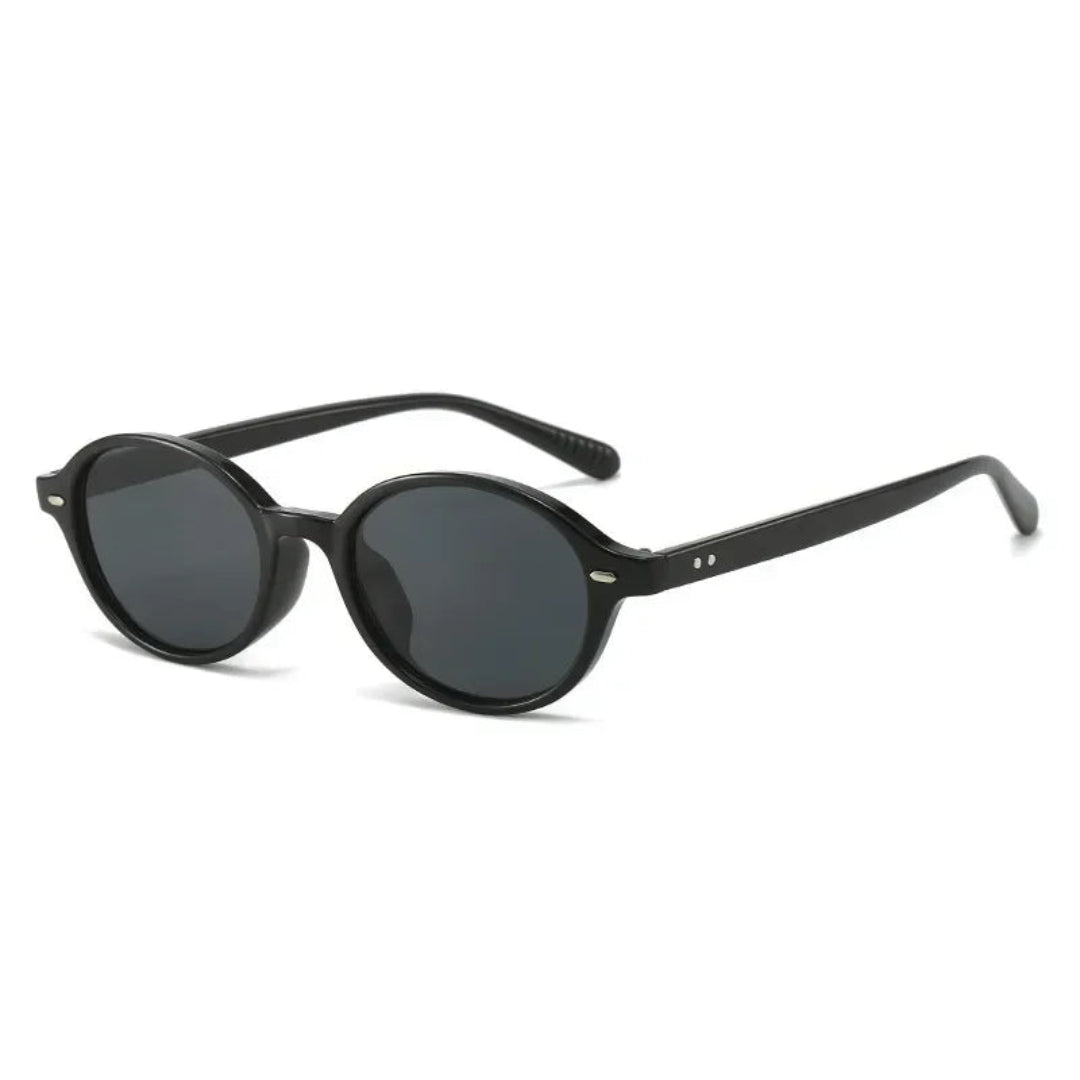 Lunéra women’s oval  shades in Black frame with Black lenses, right 3/4 angle on white background