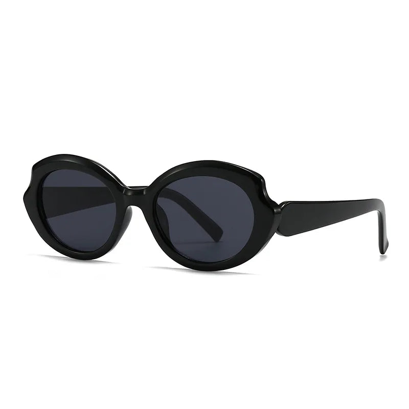 Amoura oversized round women's sunglasses in black acetate frame with black polycarbonate lenses, 100% UV protection, left 3/4 angle front view on white background