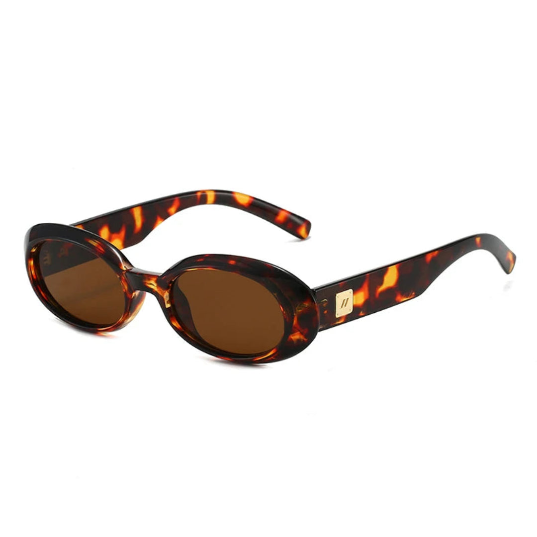 Right 3/4 angle of Vienna women’s oval sunglasses in Tortoise frame with Amber lenses, on white background — acetate frame, polycarbonate lenses, 100% UV protection