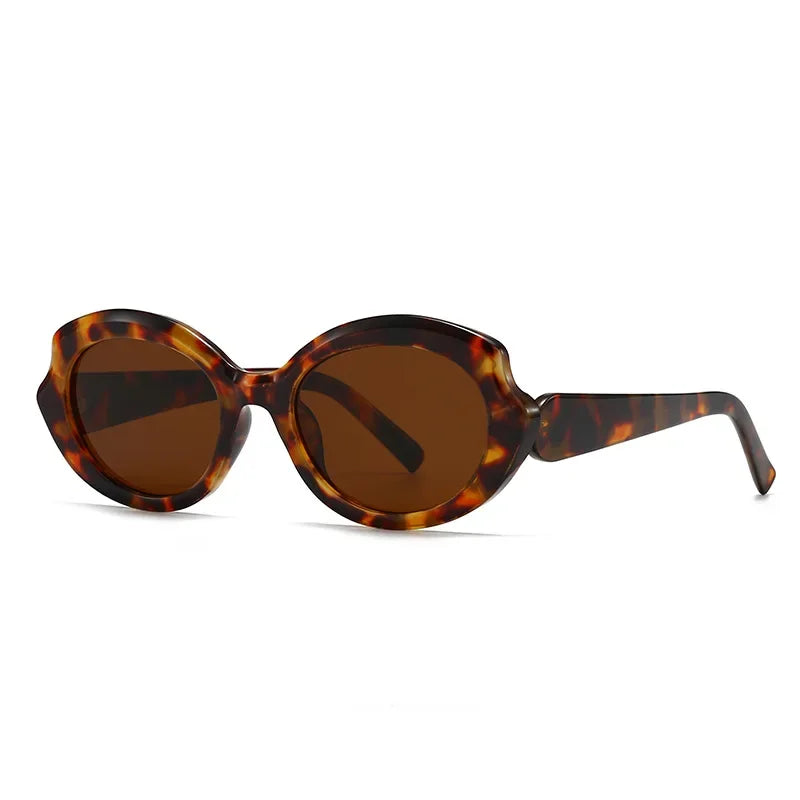Amoura oversized round women's sunglasses in tortoise acetate frame with brown polycarbonate lenses, 100% UV protection, left 3/4 angle front view on white background
