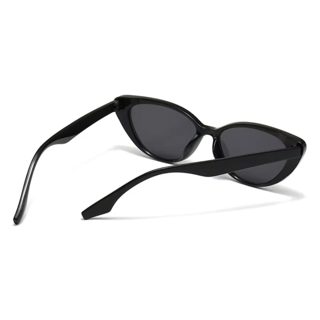 Rear view of Noire women’s cat-eye sunglasses in Black frame with Black lenses, temples not crossed, on white background — polycarbonate frame, acrylic lenses, 100% UV protection