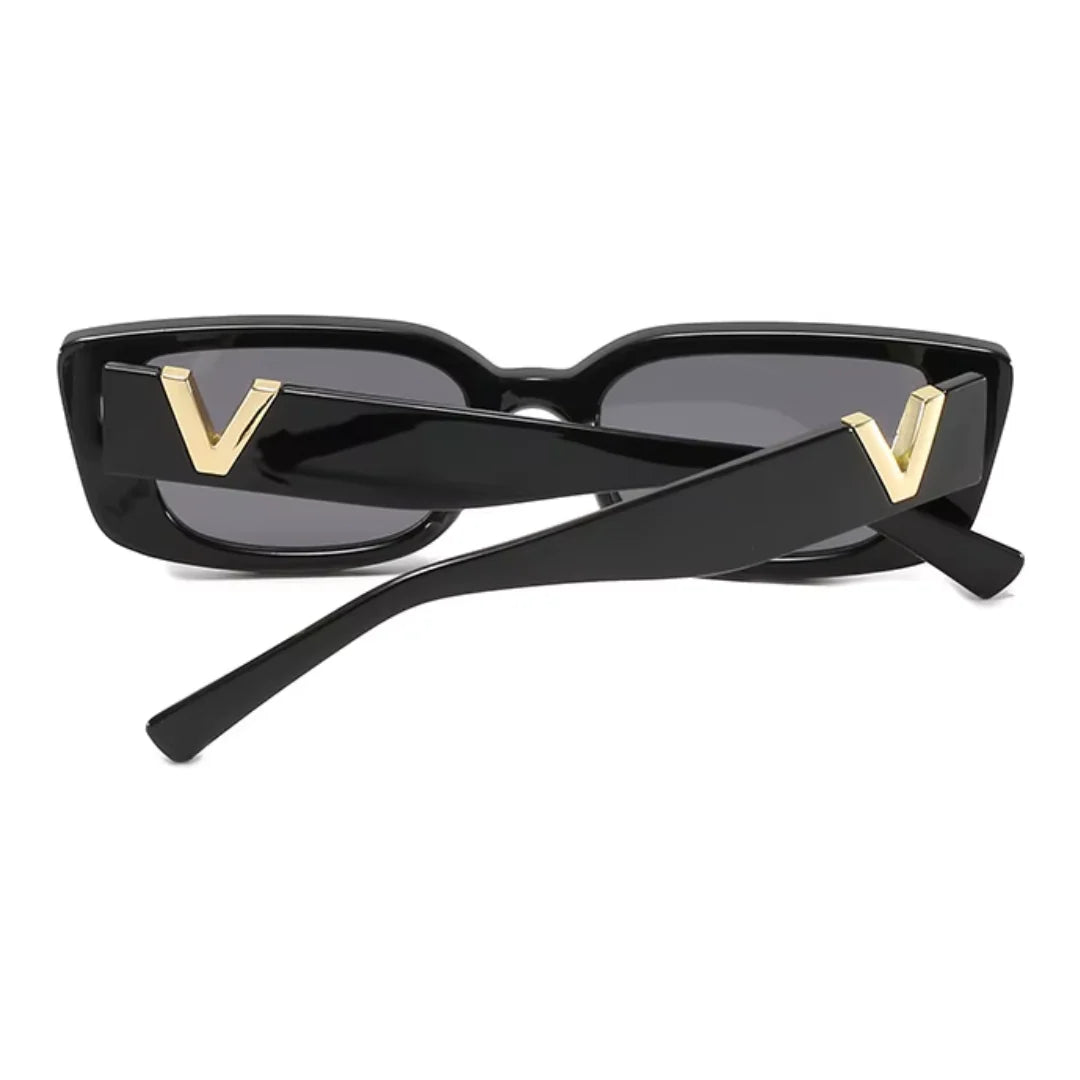 Rear view of Celestia women’s rectangle sunglasses in Black frame with Black lenses, temples crossed, on white background — acetate frame, polycarbonate lenses, 100% UV protection