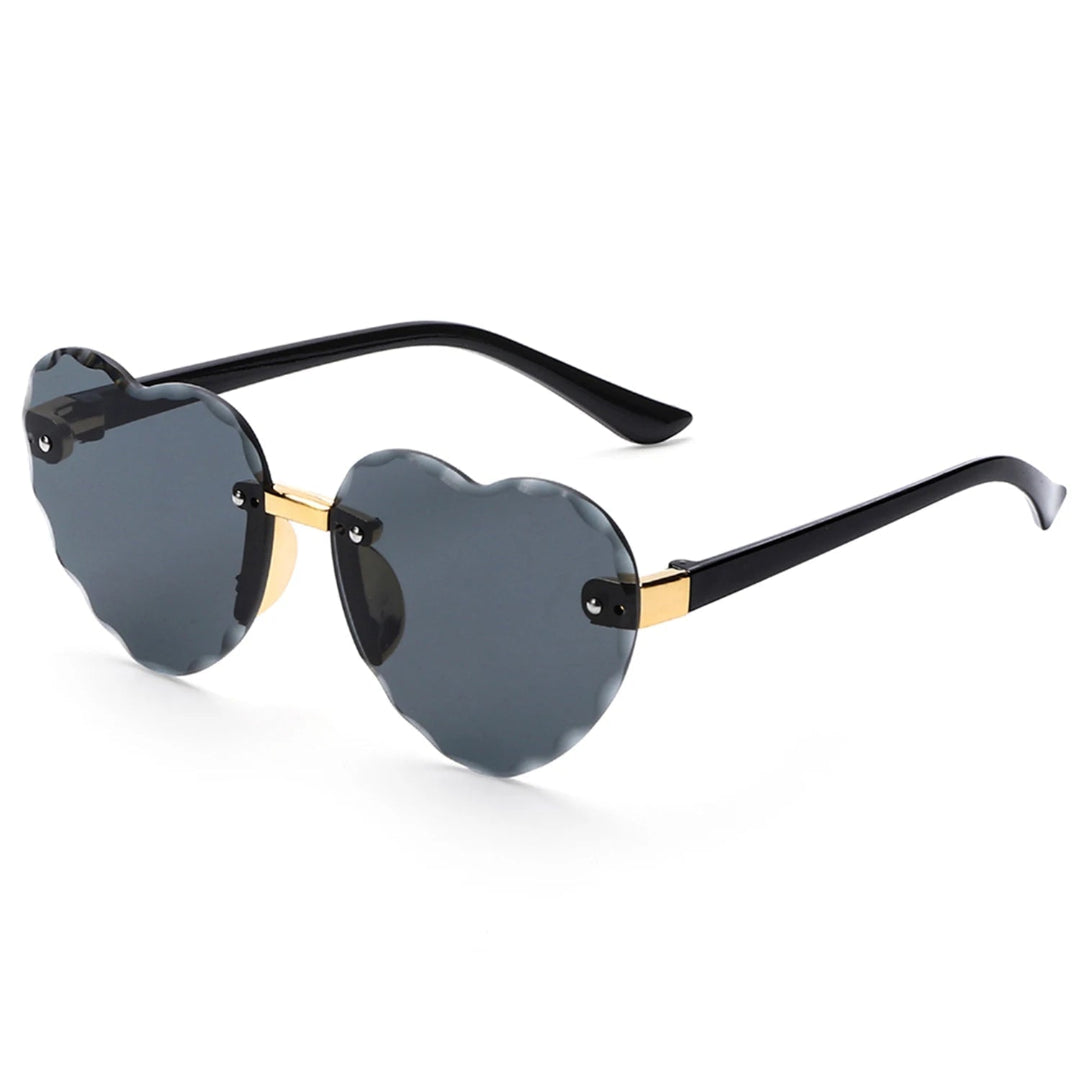 Noémie women’s heart-shaped sunglasses in Black frame with Black lenses, right 3/4 angle on white background — polycarbonate frame, polycarbonate lenses, 100% UV protection