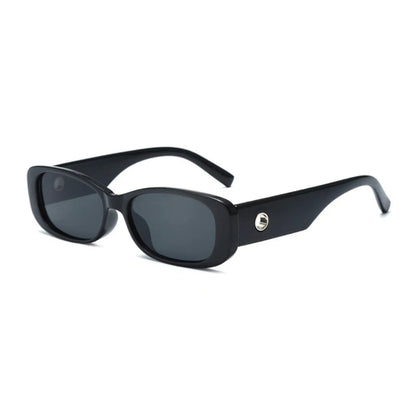 Right 3/4 angle of Milan women’s rectangular sunglasses in Black frame with Black lenses, on white background — premium acetate frame, Trivex lenses, 100% UV protection