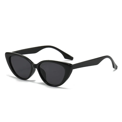 Right 3/4 angle of Noire women’s cat-eye shades in Black frame with Black lenses, on white background — polycarbonate frame, acrylic lenses, 100% UV protection