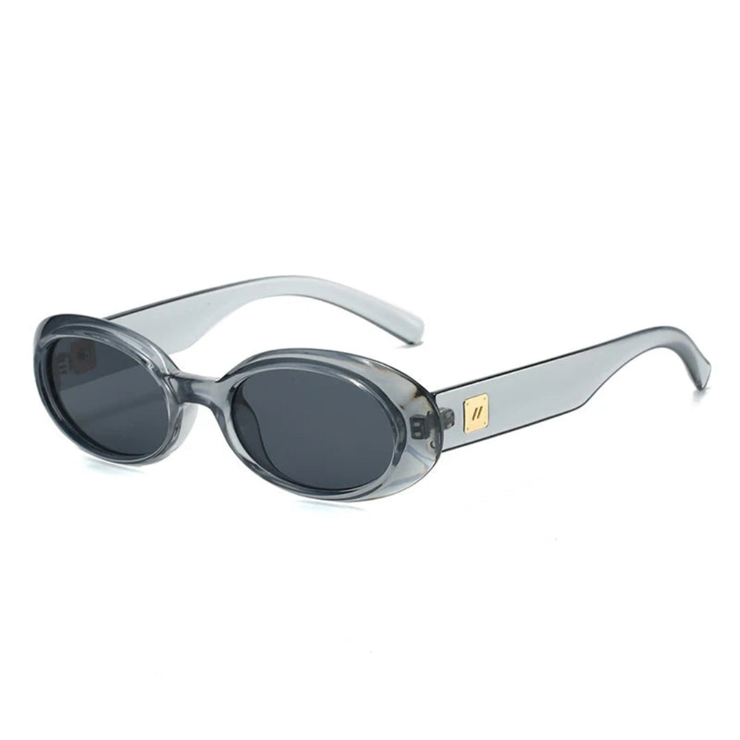 Right 3/4 angle of Vienna women’s oval sunglasses in Transparent Gray frame with Black lenses, on white background — acetate frame, polycarbonate lenses, 100% UV protection